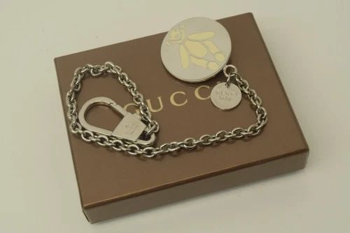 AUTHENTIC GUCCI BABY WHITE BEAR EMBLEM ROUND BAG CHARM KEYCHAIN ACCESSORY SILVER: AUTHENTIC GUCCI BABY WHITE BEAR EMBLEM ROUND BAG CHARM KEYCHAIN ACCESSORY SILVER Authentic Gucci Baby White Bear Emblem Round Bag Charm Keychain Accessory Silver Authentic Gucci Baby White Bear Emblem