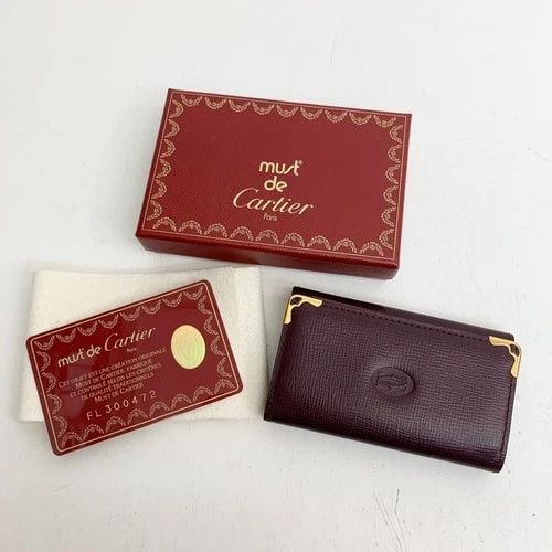 AUTHENTIC CARTIER BURGUNDY LEATHER KEY RING WALLET LOGO GP VINTAGE CARD HOLDER 3: AUTHENTIC CARTIER BURGUNDY LEATHER KEY RING WALLET LOGO GP VINTAGE CARD HOLDER 3 AUTHENTIC CARTIER BURGUNDY LEATHER KEY RING WALLET LOGO GP VINTAGE CARD HOLDER 3 Leather, Gold Plated Signature Emblem 