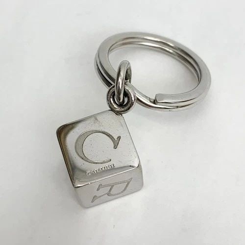 AUTHENTIC CARTIER KEYCHAIN SP LETTER CUBE SILVER DANGLE BAG KEY RING ACCESSORY: AUTHENTIC CARTIER KEYCHAIN SP LETTER CUBE SILVER DANGLE BAG KEY RING ACCESSORY Cartier Key Chain, Bag Charm Fashion, Chic Key Ring, Clip, Accessory Silver Plated Manufactured: Spain Length: 5.7 cm Emb