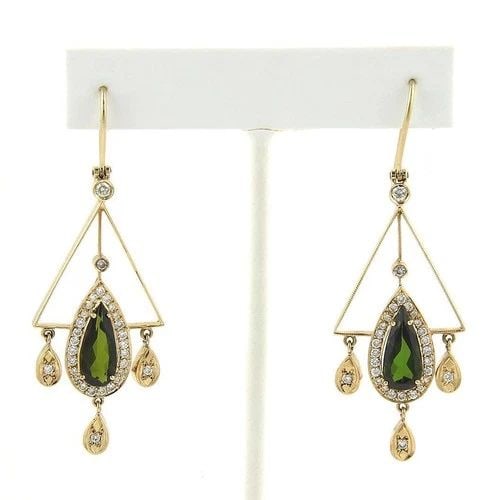 DIAMOND & GEMS GOLD EARRINGS 5.90CT 18K YELLOW CHANDELIER STYLE: DIAMOND & GEMS GOLD EARRINGS 5.90CT 18K YELLOW CHANDELIER STYLE These beautiful diamond and tourmaline earrings feature a chandelier design set in 18k yellow gold. The large green gemstones are tourma