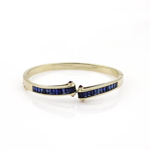 ESTATE 5.40CT SAPPHIRE & RUBY 14K YELLOW GOLD FANCY BANGLE BRACELET: ESTATE 5.40CT SAPPHIRE & RUBY 14K YELLOW GOLD FANCY BANGLE BRACELET Estate 5.40ct Sapphire & Ruby 14k Yellow Gold Fancy Bangle Bracelet Description This beautiful Estate bracelet is crafted from 14k y