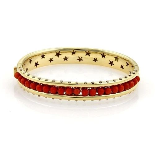 H. STERN GOLD CORAL BRACELET 18K YELLOW BEAD WIDE HINGED BANGLE: H. STERN GOLD CORAL BRACELET 18K YELLOW BEAD WIDE HINGED BANGLE The H. Stern Gold Coral Bracelet is a stunning piece of fine jewelry crafted in 18k yellow gold. This wide hinged bangle features round 