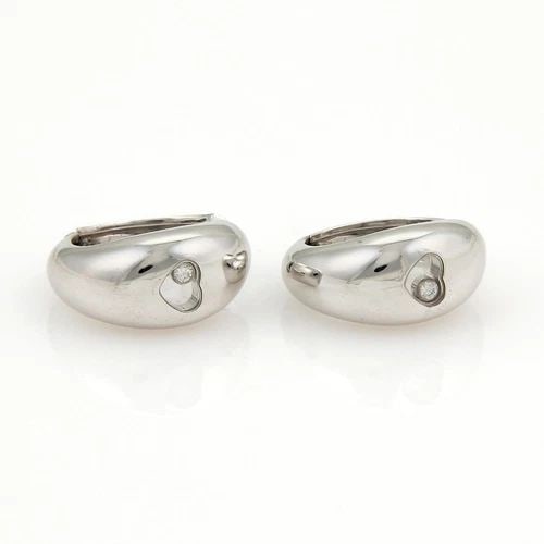CHOPARD HAPPY DIAMOND EARRINGS 18K WHITE GOLD HEART HOOP EARRINGS: CHOPARD HAPPY DIAMOND EARRINGS 18K WHITE GOLD HEART HOOP EARRINGS The Chopard Happy Diamond Earrings are exquisite 18k white gold dome shaped hoop earrings featuring a glass case in a heart shape with
