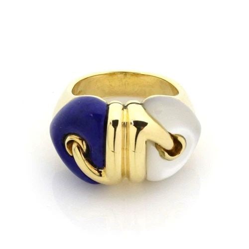 BVLGARI BULGARI RING 18K YELLOW GOLD GEMSTONES DOUBLE HEART: BVLGARI BULGARI RING 18K YELLOW GOLD GEMSTONES DOUBLE HEART The Bvlgari Bulgari Ring in 18k Yellow Gold features a double heart design with white and blue gemstones. Crafted in Italy, this elegant ban