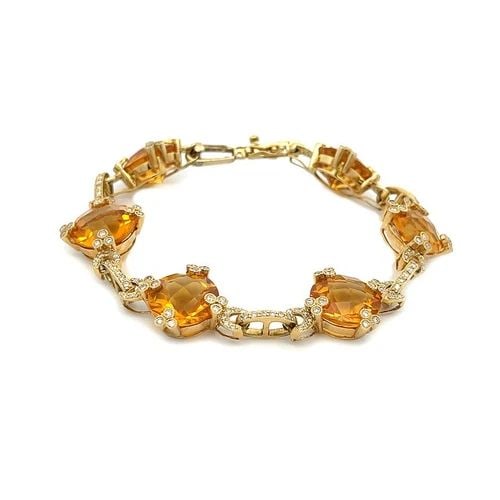 CITRINE & DIAMOND GOLD BRACELET 18K YELLOW GOLD FLORAL ROUND LINK: CITRINE & DIAMOND GOLD BRACELET 18K YELLOW GOLD FLORAL ROUND LINK This gorgeous bracelet is crafted in 18k yellow gold featuring 6 round faceted cut citrine gemstones held securely by floral set prong