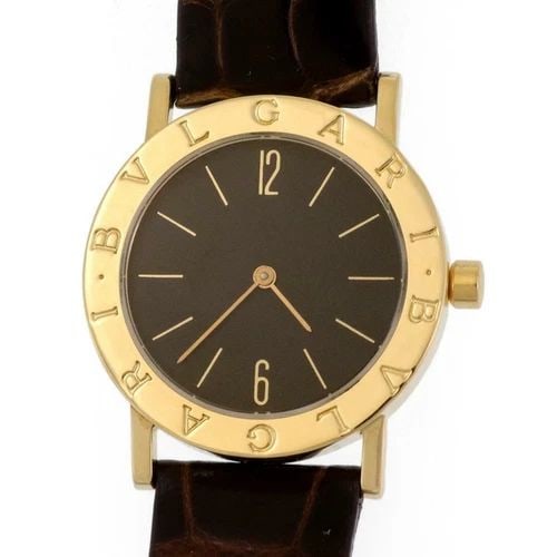 BVLGARI 18K GOLD MEN'S WATCH WITH LEATHER BAND: BVLGARI 18K GOLD MEN'S WATCH WITH LEATHER BAND Bvlgari Engraved Bezel 18k Yellow Gold Leather Band Men's Watch Quartz Description This is an authentic men's wrist watch by Bvlgari. The case and buckle