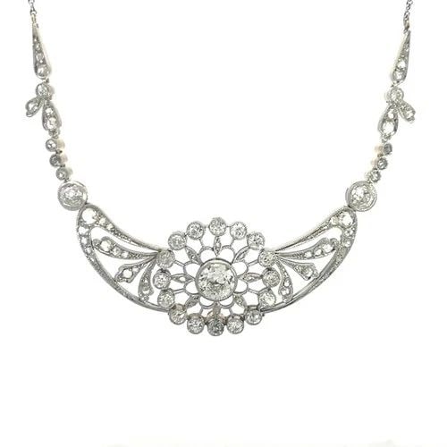DECO DIAMOND PLATINUM NECKLACE GOLD FLORAL CENTERPIECE W/CHAIN: DECO DIAMOND PLATINUM NECKLACE GOLD FLORAL CENTERPIECE W/CHAIN This is a stunning Art Deco necklace; it features a long-curved shape centerpiece with a large open style round flower in the center deco