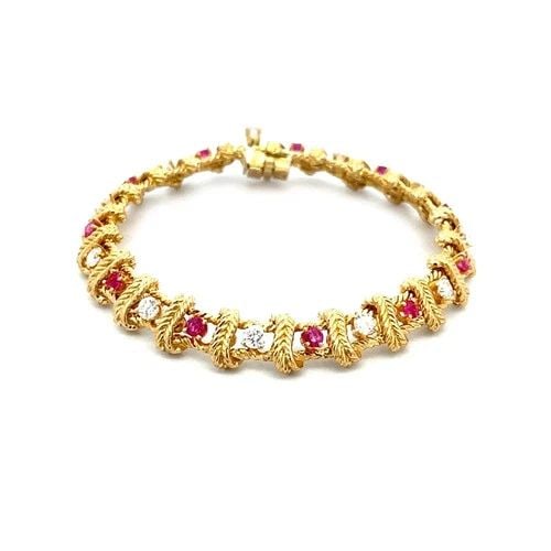 PLACE VENDOME DIAMOND RUBY GOLD BRACELET 18K YELLOW LEAF CROSS BAR DESIGN: PLACE VENDOME DIAMOND RUBY GOLD BRACELET 18K YELLOW LEAF CROSS BAR DESIGN This 18k yellow gold bracelet by Place Vendome, it features a beautiful design with square section and leaf style cross bars, 