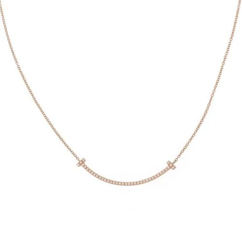 TIFFANY & CO. "T SMILE" DIAMOND 18K ROSE GOLD PENDANT & CHAIN NECKLACE: TIFFANY & CO. "T SMILE" DIAMOND 18K ROSE GOLD PENDANT & CHAIN NECKLACE Tiffany & Co. "T Smile" Diamond 18k Rose Gold Pendant & Chain Necklace small Size Description This beautiful authentic necklace b