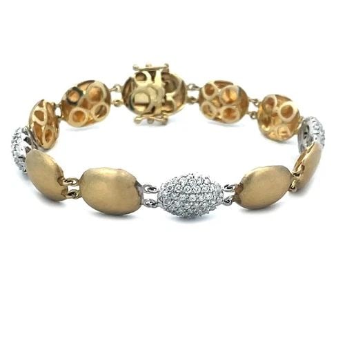 70529 DIAMOND GOLD BRACELET 14K TWO TONE PAVE SET OVAL BUTTON LINK STYLE: 70529 DIAMOND GOLD BRACELET 14K TWO TONE PAVE SET OVAL BUTTON LINK STYLE This is a gorgeous diamond bracelet; it is crafted from 14k yellow gold with white gold accent that adds an elegant touch to an