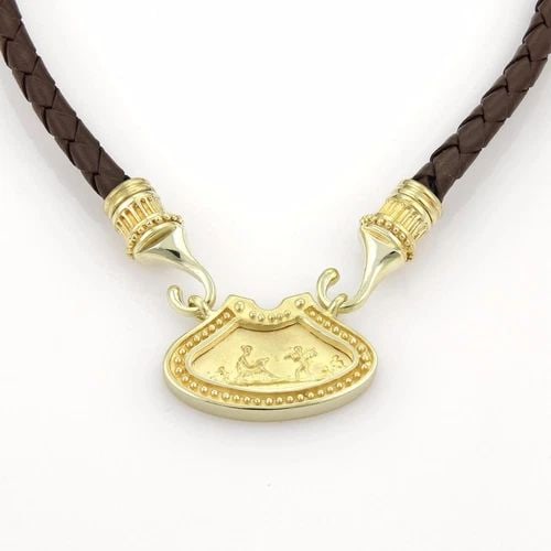 GOLD LEATHER NECKLACE 14K YELLOW CHERUBS & NYMPHS WOVEN CORD NECKLACE: GOLD LEATHER NECKLACE 14K YELLOW CHERUBS & NYMPHS WOVEN CORD NECKLACE This is a lovely vintage necklace; the pendant and hook clasp is crafted from 14k yellow gold in a polished and smooth textured fi