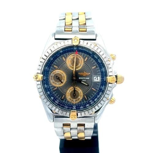 BREITLING CHRONOMAT MEN'S WATCH CHRONOGRAPH 40MM DATE TWO TONE STEEL B13044: BREITLING CHRONOMAT MEN'S WATCH CHRONOGRAPH 40MM DATE TWO TONE STEEL B13044 The Breitling Chronomat men's watch is a classic timepiece featuring a stainless steel with yellow gold accents. This 40mm c