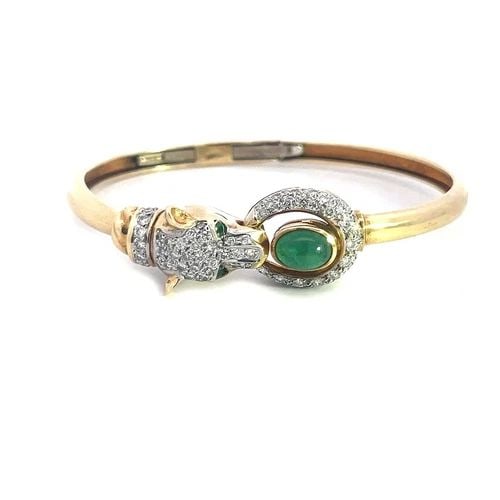 DIAMOND GOLD GEM PANTHER BANGLE 14K TWO TONE DOORKNOCKER STYLE: DIAMOND GOLD GEM PANTHER BANGLE 14K TWO TONE DOORKNOCKER STYLE This lovely flex hinged bracelet is crafted from 14k yellow gold with white gold accent. It features the hinged mechanism on the band of 
