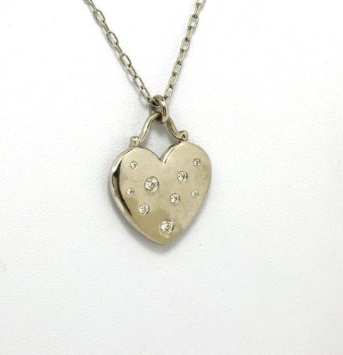 TIFFANY & CO. DIAMOND GOLD NECKLACE 18K WHITE HEART PENDANT & CHAIN: TIFFANY & CO. DIAMOND GOLD NECKLACE 18K WHITE HEART PENDANT & CHAIN The Tiffany & Co. Diamond Gold Necklace is a stunning piece of fine jewelry featuring an 18k white gold pendant in the shape of a he
