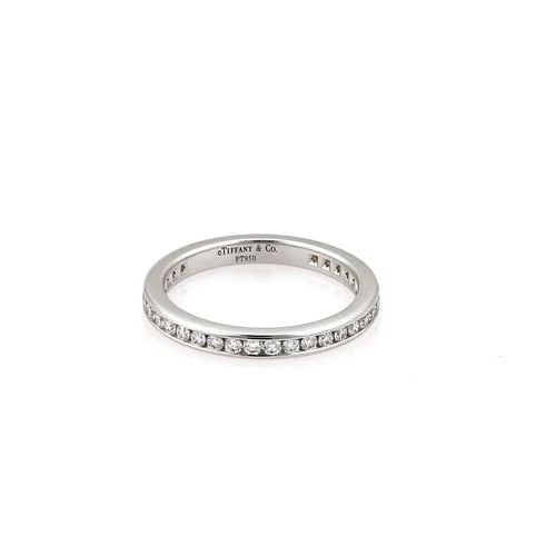 TIFFANY & CO. ETERNITY RING WEDDING BAND DIAMOND PLATINUM SIZE 5.5: TIFFANY & CO. ETERNITY RING WEDDING BAND DIAMOND PLATINUM SIZE 5.5 The product is a Tiffany & Co. Eternity Ring Wedding Band made of platinum with round-cut white diamond stones. It is a size 5.5 and 