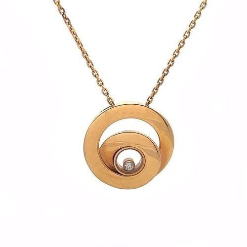 CHOPARD HAPPY DIAMOND NECKLACE 18K ROSE GOLD CIRCLE STYLE W/CHAIN: CHOPARD HAPPY DIAMOND NECKLACE 18K ROSE GOLD CIRCLE STYLE W/CHAIN From the Happy Diamond Collection by Chopard, this lovely pendant and chain necklace is crafted from 18k rose gold. The one stroke dou