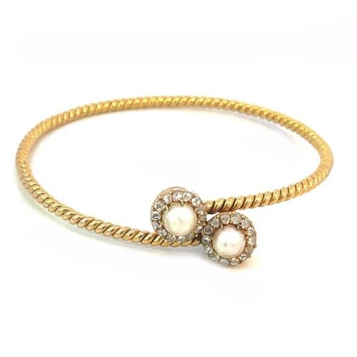 VICTORIAN ROSE CUT DIAMOND GOLD BANGLE 18K YELLOW PEARLS BYPASS STYLE: VICTORIAN ROSE CUT DIAMOND GOLD BANGLE 18K YELLOW PEARLS BYPASS STYLE This beautiful Victorian Era bracelet is crafted from 18k yellow gold featuring a 2mm thick twisted wire cable band with a bypass 