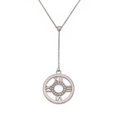 TIFFANY & CO. ATLAS DIAMOND 18K WHITE GOLD ROUND PENDANT LARIAT NECKLACE: TIFFANY & CO. ATLAS DIAMOND 18K WHITE GOLD ROUND PENDANT LARIAT NECKLACE Tiffany & Co. Atlas Diamond 18k White Gold Round Pendant Lariat Necklace Description From the ATLAS Collection by Tiffany & Co.