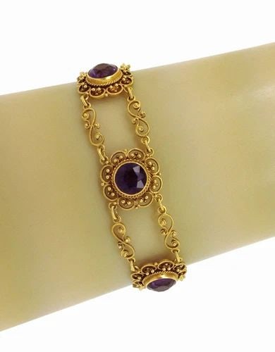 VICTORIAN 20K GOLD GEM BRACELET: VICTORIAN 20K GOLD GEM BRACELET This Victorian 20k Gold gem bracelet features a stunning purple gemstone set in yellow gold. The vintage piece has a chain style and is resizable, making it a versatile