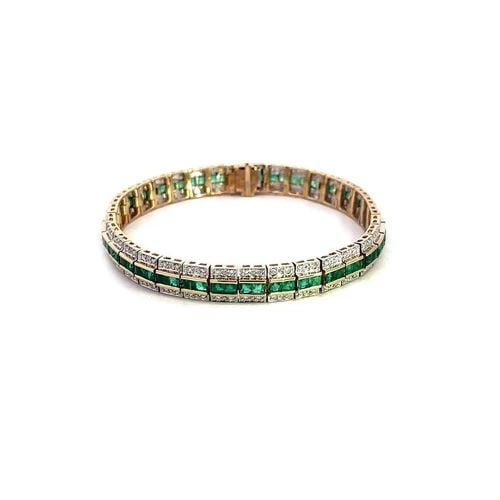 DIAMOND EMERALD GOLD BRACELET AMORO SIGNED 14K TWO TONE FLEX LINKS: DIAMOND EMERALD GOLD BRACELET AMORO SIGNED 14K TWO TONE FLEX LINKS This lovely bracelet is crafted from 14k yellow and white gold featuring small flexible section links with square cut emerald along t