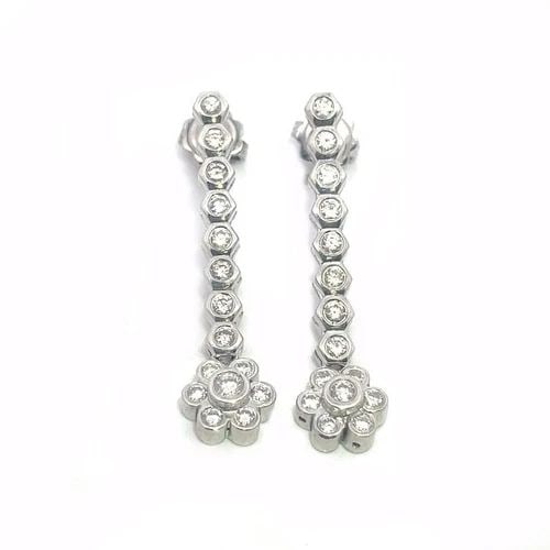 70188 DIAMOND 18K GOLD EARRINGS WHITE FLORAL DROP DANGLE STYLE: 70188 DIAMOND 18K GOLD EARRINGS WHITE FLORAL DROP DANGLE STYLE This is a gorgeous pair of long dangle earrings, they are crafted from 18k white gold featuring 3.5mm round bezel set diamond in a vertic