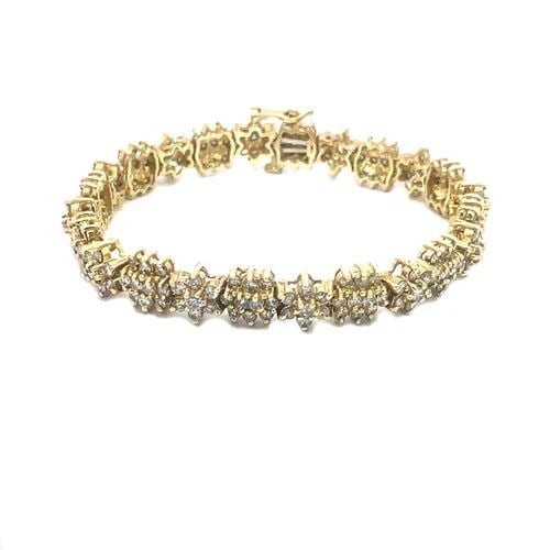 DIAMOND GOLD BRACELET 14K YELLOW STAR FLOWER LINK DESIGN: This beautiful diamond and gold bracelet is a fine piece of jewelry crafted with a 14k yellow gold metal featuring chasing flower link design adorned with prong set round white diamond. The floral lin