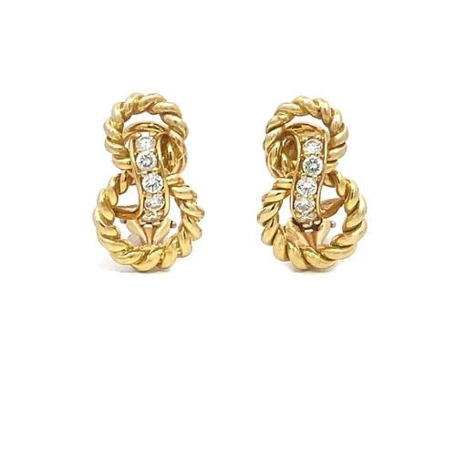 TIFFANY & CO. DIAMOND GOLD EARRINGS VINTAGE 18K YELLOW KNOT STYLE: TIFFANY & CO. DIAMOND GOLD EARRINGS VINTAGE 18K YELLOW KNOT STYLE These lovely authentic vintage earrings are from Tiffany & Co. They are crafted from 18k yellow gold featuring an interlaced double wi