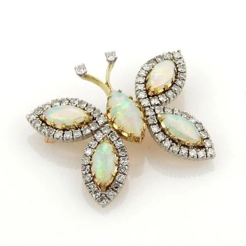 OPAL GOLD BUTTERFLY BROOCH DIAMOND 18K YELLOW VINTAGE: OPAL GOLD BUTTERFLY BROOCH DIAMOND 18K YELLOW VINTAGE This adorable butterfly gold brooch features a stunning design with the marquise cut opals set as the body in prong set yellow gold and the wings 
