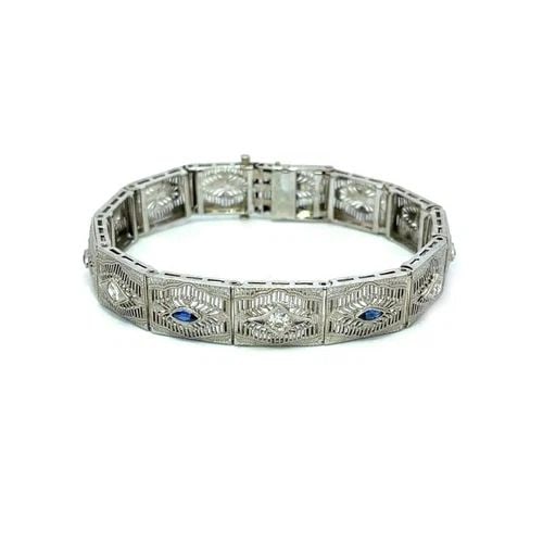 DIAMOND 14K ART DECO WHITE GOLD FILIGREE RECTANGLE LINK BRACELET: DIAMOND 14K ART DECO WHITE GOLD FILIGREE RECTANGLE LINK BRACELET This lovely Art Deco bracelet is crafted from 14k white gold featuring rectangle shape links joined together by hinged pins. Each link 