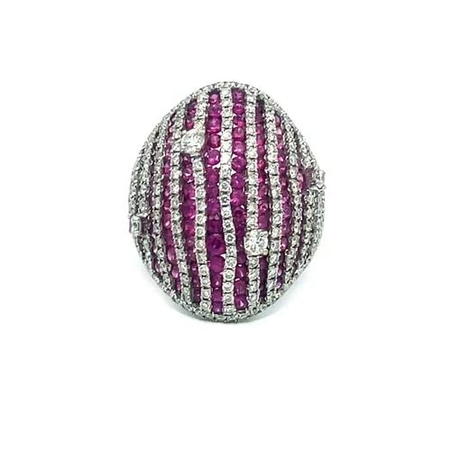 PINK SAPPHIRE GOLD RING DIAMOND 18K WHITE DOME TOP STRIPE DESIGN: PINK SAPPHIRE GOLD RING DIAMOND 18K WHITE DOME TOP STRIPE DESIGN This is a timeless piece that marries the sparkle of diamonds with the allure of white gold and bright pink sapphires. The ring showcas