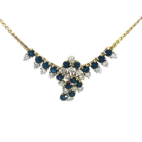 DIAMOND SAPPHIRE GOLD NECKLACE 18K YELLOW CLUSTER FLEX CENTERPIECE: DIAMOND SAPPHIRE GOLD NECKLACE 18K YELLOW CLUSTER FLEX CENTERPIECE This is a stunning diamond sapphire gold necklace. It is crafted in 18k yellow gold, this lovely piece features a floral-shaped penda