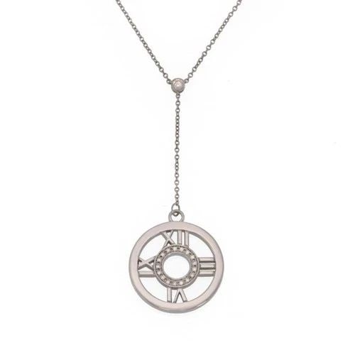 TIFFANY & CO. NECKLACE ATLAS DIAMOND 18K WHITE GOLD ROUND PENDANT LARIAT: TIFFANY & CO. NECKLACE ATLAS DIAMOND 18K WHITE GOLD ROUND PENDANT LARIAT The Tiffany & Co. Necklace Atlas Diamond in 18k White Gold is a luxurious and stylish piece of fine jewelry. Featuring round na