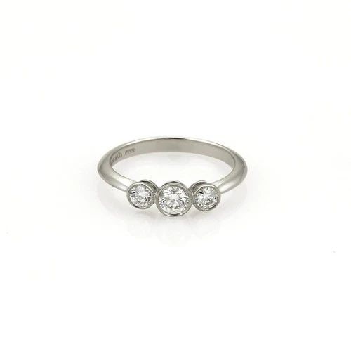 TIFFANY & CO. 3 DIAMOND RING PLATINUM WEDDING BAND KNIFE EDGE SIZE - 4: TIFFANY & CO. 3 DIAMOND RING PLATINUM WEDDING BAND KNIFE EDGE SIZE - 4 This gorgeous authentic ring is by Tiffany & Co. it is crafted from platinum with a polished finish and has a knife edge band wit