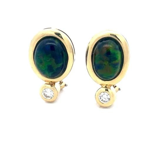 DIAMOND GOLD EARRINGS FIRE GEMSTONE 18K YELLOW CLIP-ON STYLE OVAL SHAPE: DIAMOND GOLD EARRINGS FIRE GEMSTONE 18K YELLOW CLIP-ON STYLE OVAL SHAPE This beautiful pair of earrings features a mesmerizing fire gemstone set in 18k yellow gold accented with a bezel set diamond be