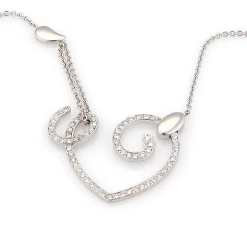 LA NOUVELLE BAGUE DIAMOND GOLD NECKLACE 18KT WHITE 1.20CT OPEN HEART PENDANT: LA NOUVELLE BAGUE DIAMOND GOLD NECKLACE 18KT WHITE 1.20CT OPEN HEART PENDANT The La Nouvelle Bague Diamond Gold Necklace is a stunning piece of fine jewelry featuring an 18kt white gold chain with a b