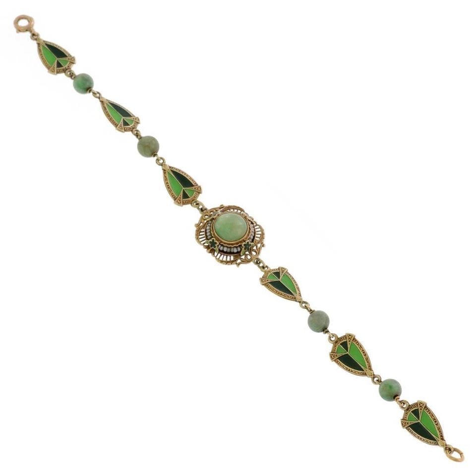 ART DECO PEARLS ENAMEL 14K YELLOW GOLD FANCY LINK BRACELET: ART DECO PEARLS ENAMEL 14K YELLOW GOLD FANCY LINK BRACELET Art Deco Pearls Enamel 14k Yellow Gold Fancy Link Bracelet Description This lovely Art Deco bracelet is crafted from 14k yellow gold, the cen