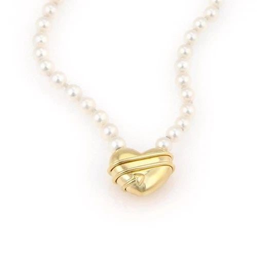 TIFFANY & CO. CUPID GOLD NECKLACE PEARLS 18K YELLOW ARROW HEART PENDANT: TIFFANY & CO. CUPID GOLD NECKLACE PEARLS 18K YELLOW ARROW HEART PENDANT The Tiffany & Co. Cupid Gold Necklace is a luxurious piece of fine jewelry featuring a stunning 18k yellow gold pendant with a c