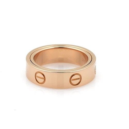 CARTIER LOVE RING SECRET 18K PINK GOLD 5.5MMSIZE 54-US 7 W/CERT: CARTIER LOVE RING SECRET 18K PINK GOLD 5.5MMSIZE 54-US 7 W/CERT The Cartier Love Ring in Secret 18k Pink Gold with a 5.5mm size 54 (US 7) is a stunning piece of fine jewelry that exudes luxury and ele