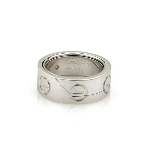 CARTIER ASTRO LOVE GOLD RING/PENDANT SECRET BALL 18K WHITE SIZE 4 W/ CERT.: CARTIER ASTRO LOVE GOLD RING/PENDANT SECRET BALL 18K WHITE SIZE 4 W/ CERT. The Cartier Astro Love Gold Ring/Pendant in 18k White is a stunning piece of fine jewelry that exudes elegance and romance. W