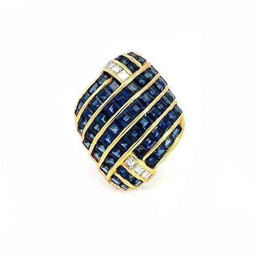 DIAMOND SAPPHIRE COCKTAIL RING 18K YELLOW GOLD RHOMBUS SHAPE: DIAMOND SAPPHIRE COCKTAIL RING 18K YELLOW GOLD RHOMBUS SHAPE This is a lovely dome rhombus shape ring from 18k yellow gold. The front features 7 rows with channel set square cut sapphires accented on 