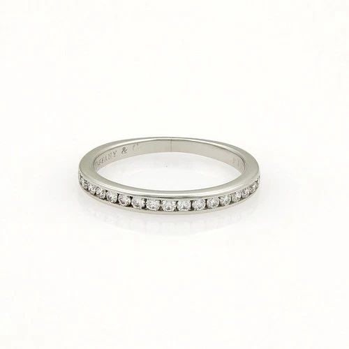 TIFFANY & CO. DIAMOND WEDDING BAND HALF CIRCLE PLATINUM: TIFFANY & CO. DIAMOND WEDDING BAND HALF CIRCLE PLATINUM The Tiffany & Co. Diamond Wedding Band Half Circle Platinum Ring is a stunning piece of fine jewelry perfect for any special occasion, especiall