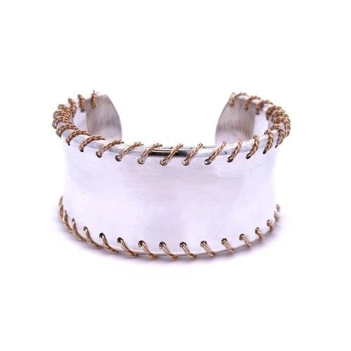 TIFFANY & CO. BRACELET STERLING SILVER 18K YELLOW GOLD 31MM WIDE CUFF: TIFFANY & CO. BRACELET STERLING SILVER 18K YELLOW GOLD 31MM WIDE CUFF This chic modern style authentic cuff bracelet is from Tiffany & Co. It is crafted from sterling silver with 18k yellow gold accen