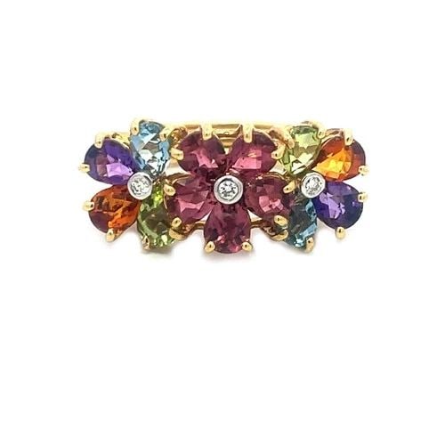 DIAMOND & GEMS GOLD RING 18K YELLOW MULTICOLOR 3 FLOWER STYLE: DIAMOND & GEMS GOLD RING 18K YELLOW MULTICOLOR 3 FLOWER STYLE This is a stunning piece of fine jewelry featuring a unique multicolor design with three flowers across the top, each center with rose pin
