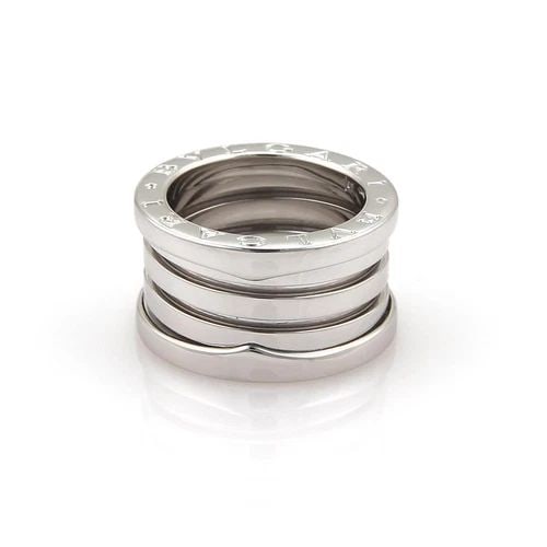 BVLGARI BULGARI RING B ZERO-1 18K WHITE GOLD 13MM SIZE EU 50-US 5: BVLGARI BULGARI RING B ZERO-1 18K WHITE GOLD 13MM SIZE EU 50-US 5 The Bvlgari Bulgari Ring B Zero-1 is a luxurious piece of fine jewelry crafted in 18k white gold. This elegant band ring, designed by 