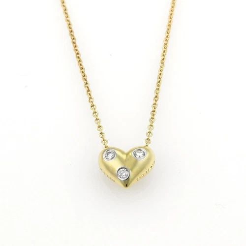 TIFFANY & CO. ETOILE HEART PENDANT DIAMONDS 18K GOLD PLATINUM NECKLACE: TIFFANY & CO. ETOILE HEART PENDANT DIAMONDS 18K GOLD PLATINUM NECKLACE Tiffany & Co. Etoile Diamonds 18k Gold Platinum Heart Pendant Necklace Description Elegant and authentic by Tiffany & Co. from th