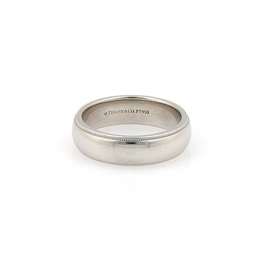 TIFFANY & CO. PLATINUM WEDDING BAND MILGRAIN DESIGN RING SIZE 8.5: TIFFANY & CO. PLATINUM WEDDING BAND MILGRAIN DESIGN RING SIZE 8.5 The Tiffany & Co. Platinum Wedding Band is a luxurious and elegant piece of jewelry perfect for both men and women. Made with 950 plat