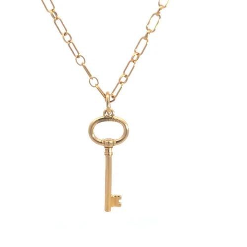 TIFFANY & CO. GOLD OVAL KEY PENDANT 18K YELLOW OVAL LINK CHAIN NECKALCE: TIFFANY & CO. GOLD OVAL KEY PENDANT 18K YELLOW OVAL LINK CHAIN NECKALCE This lovely necklace is crafted from 18k yellow gold featuring an oval key pendant by Tiffany & Co. the key comes with a 3mm wid