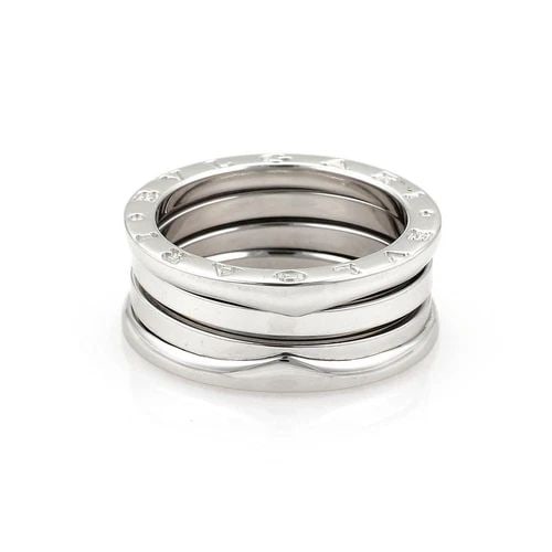 BVLGARI BULGARI RING B ZERO-1 18K WHITE GOLD 9MM BAND SIZE EU 56-US 7.5: The Bvlgari Bulgari Ring B Zero-1 is a luxurious piece of fine jewelry crafted in 18k white gold with a sleek 9mm band design. Made in Italy, this ring is signed by the renowned Bvlgari brand and feat