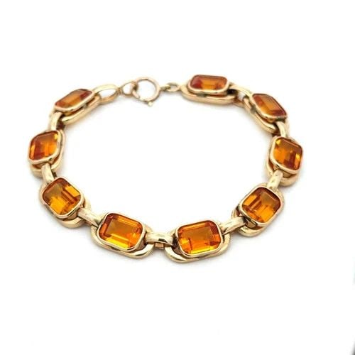 CITRINE GOLD BRACELET 14K YELLOW EMERALD CUT OVAL BEZEL SET STYLE VINTAGE: CITRINE GOLD BRACELET 14K YELLOW EMERALD CUT OVAL BEZEL SET STYLE VINTAGE This gorgeous citrine bracelet is a vintage piece featuring alternating small and large 14k yellow gold oval frame links, the 