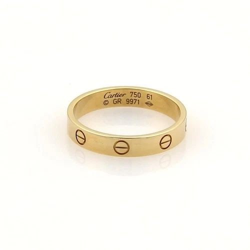 CARTIER MINI LOVE GOLD RING 18K YELLOW BAND SIZE 9.75: CARTIER MINI LOVE GOLD RING 18K YELLOW BAND SIZE 9.75 From the Love Collection by Cartier, this elegant Mini Love ring is 18k yellow gold with a fine polished finish. It is a signed by the designer wi